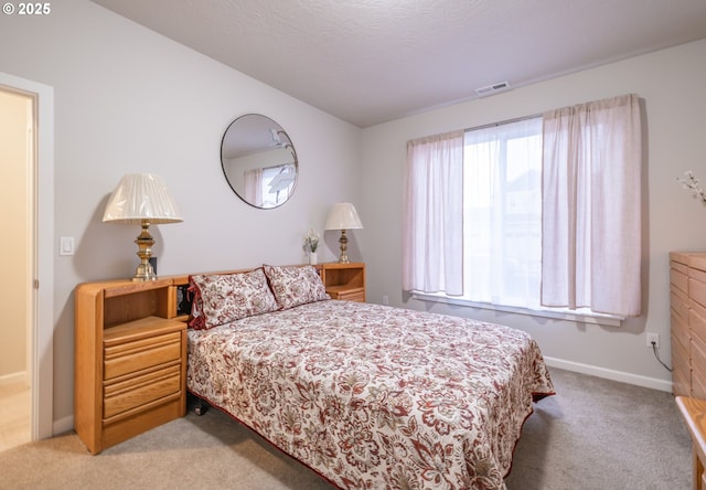 carpeted bedroom featuring baseboards