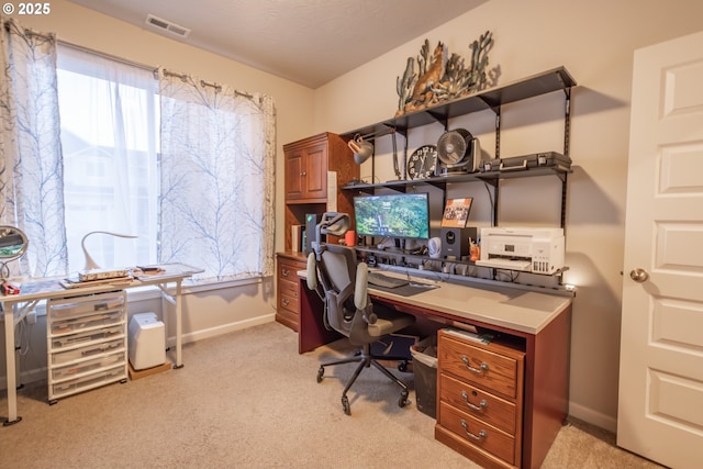 office space with light colored carpet and baseboards
