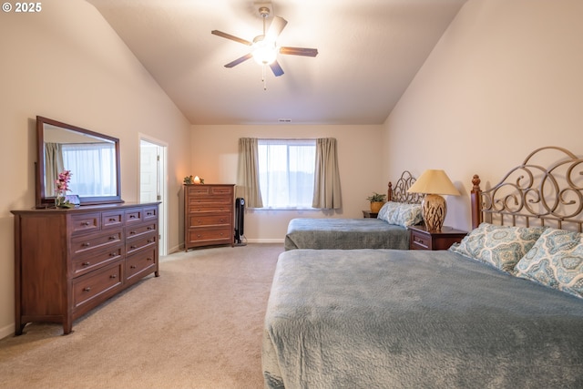 bedroom featuring lofted ceiling, light colored carpet, baseboards, and a ceiling fan