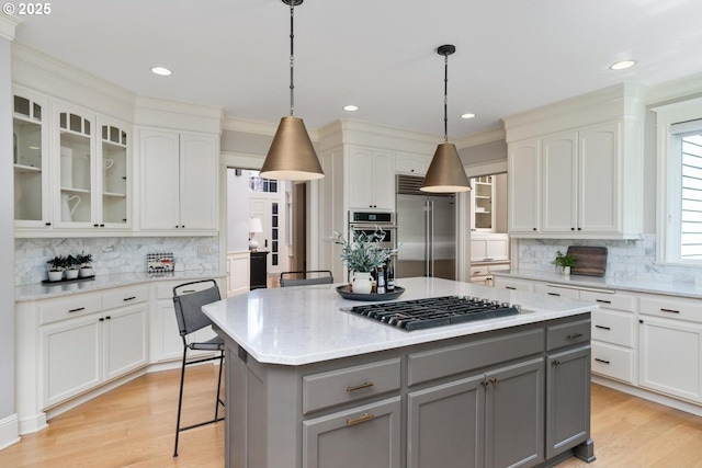 kitchen featuring gray cabinetry, stainless steel appliances, tasteful backsplash, white cabinets, and recessed lighting