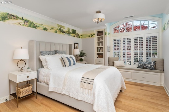 bedroom featuring light wood-style floors