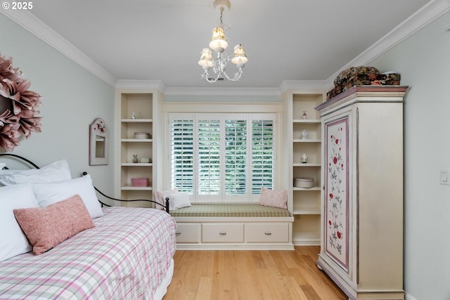 bedroom with light wood-style flooring, a chandelier, and crown molding