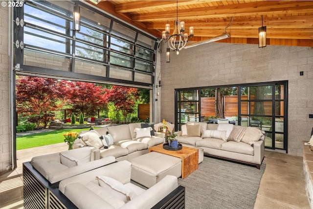 living room featuring wood ceiling, a chandelier, a high ceiling, concrete flooring, and beam ceiling