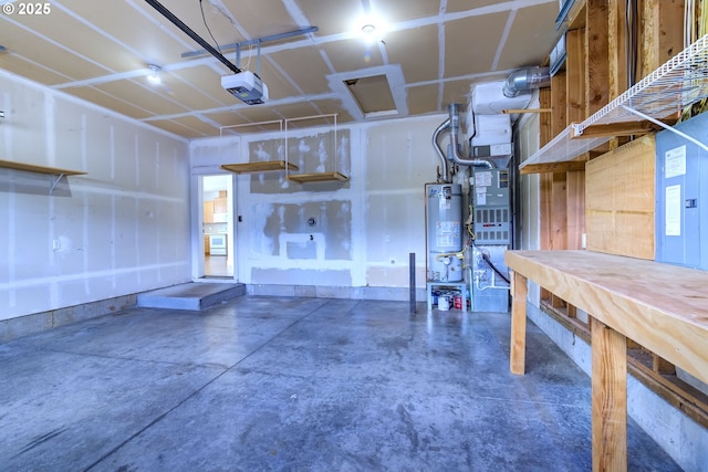 705 NW 25th Ave, Battle Ground, WA 98604 - garage featuring water heater, a workshop area, and a garage door opener