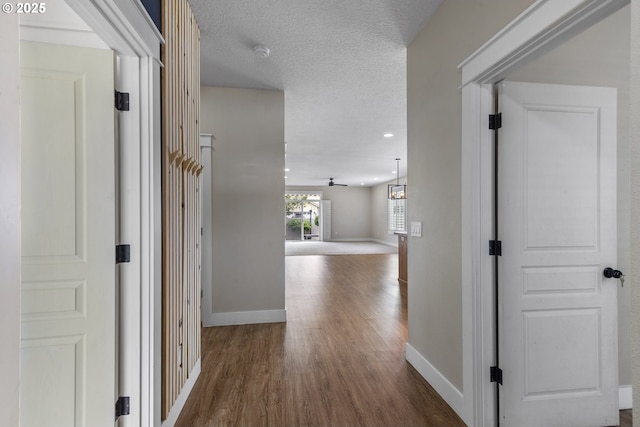 705 NW 25th Ave, Battle Ground, WA 98604 - hall with wood finished floors, baseboards, a textured ceiling, and recessed lighting