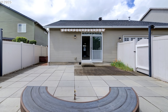 705 NW 25th Ave, Battle Ground, WA 98604 - rear view of property with a patio area, a fenced backyard, roof with shingles, and a gate
