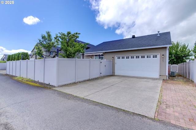 705 NW 25th Ave, Battle Ground, WA 98604 - view of home's exterior with central air condition unit, driveway, a gate, and an attached garage