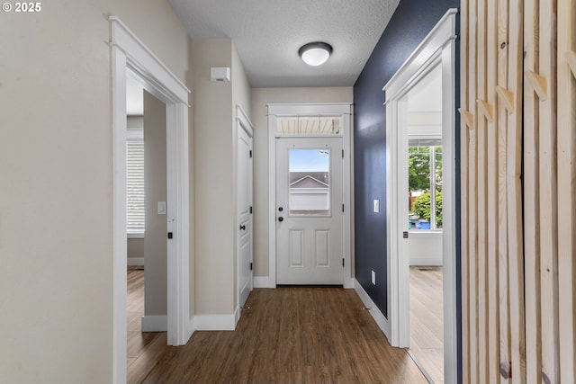 705 NW 25th Ave, Battle Ground, WA 98604 - entrance foyer with wood finished floors, baseboards, and a textured ceiling