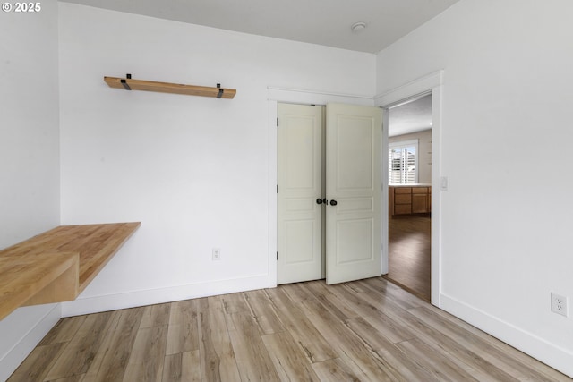 705 NW 25th Ave, Battle Ground, WA 98604 - empty room with wood finished floors, baseboards, and a smoke detector