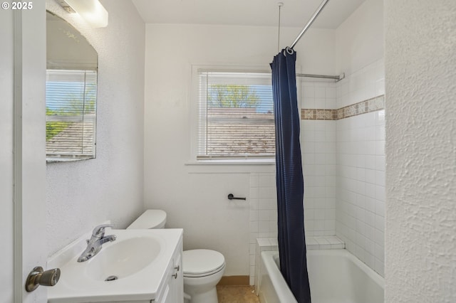 full bath featuring vanity, shower / bathtub combination with curtain, a healthy amount of sunlight, and toilet