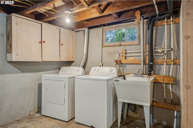 laundry room featuring cabinet space and washer and clothes dryer