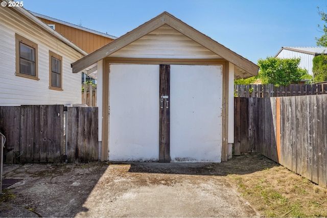 view of shed with fence