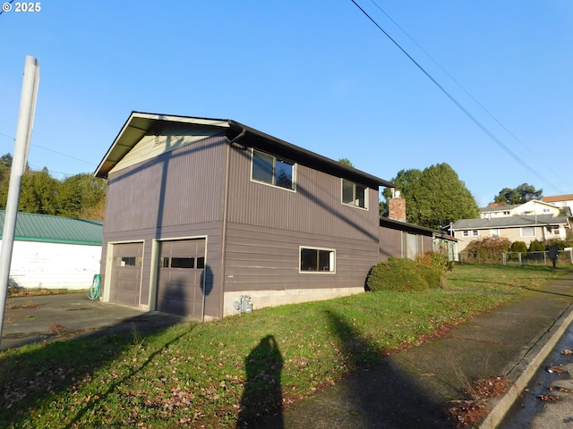 view of side of home with a garage