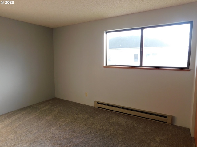 carpeted empty room with baseboard heating and a textured ceiling