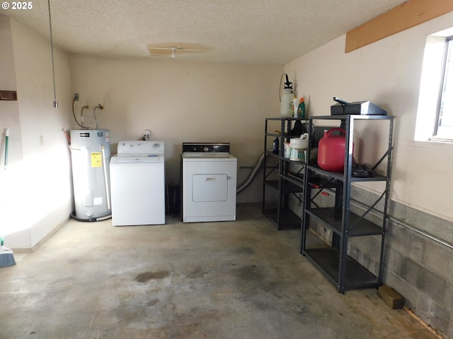 basement featuring washer and dryer, water heater, and a textured ceiling