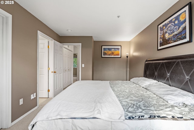 bedroom featuring carpet flooring and baseboards