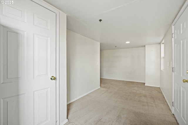 carpeted spare room with baseboards