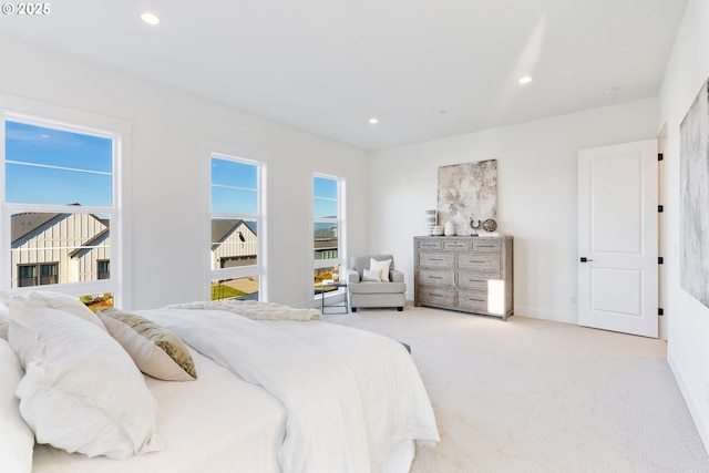 bedroom featuring light colored carpet