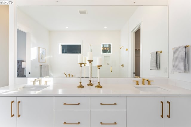 bathroom with vanity and an enclosed shower