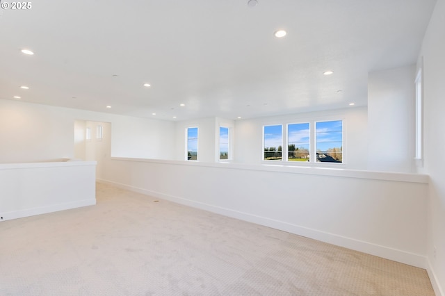 unfurnished room with light carpet