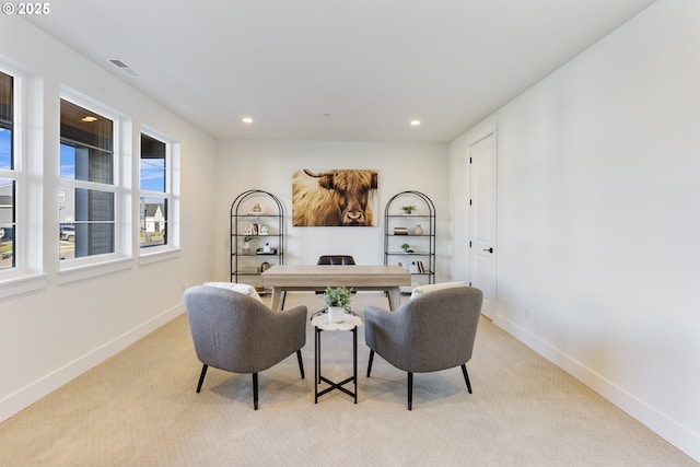 office space with light colored carpet