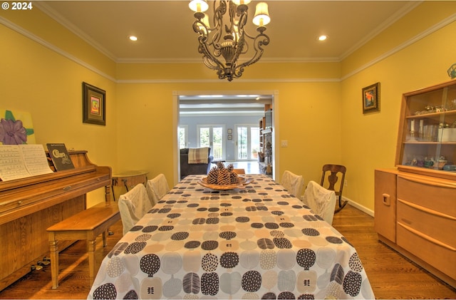 17130 Eastwood Ln, Brookings, OR 97415 - dining area with a chandelier, ornamental molding, wood finished floors, and recessed lighting