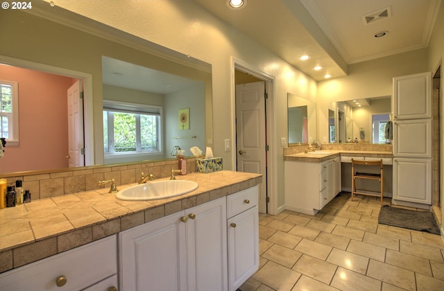 17130 Eastwood Ln, Brookings, OR 97415 - bathroom with crown molding, two vanities, recessed lighting, and tile patterned floors