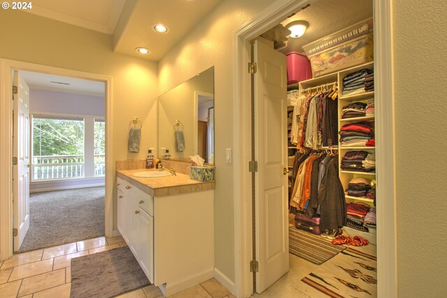 17130 Eastwood Ln, Brookings, OR 97415 - bathroom featuring ornamental molding, vanity, tile patterned floors, recessed lighting, and a spacious closet