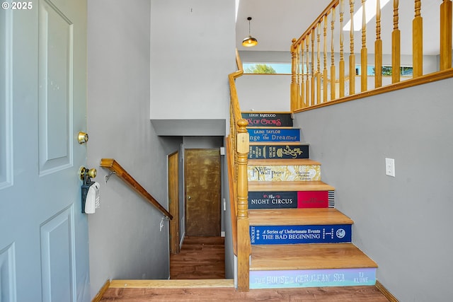 stairway with wood finished floors