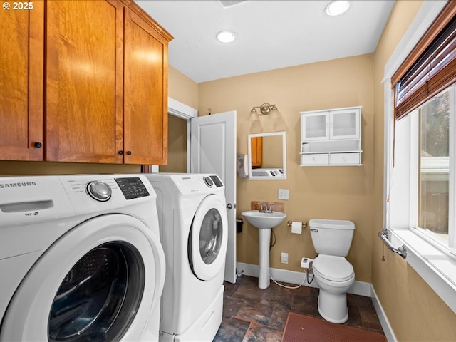 13283 NW Main St, Banks, OR 97106 - laundry room with independent washer and dryer, baseboards, stone finish flooring, and recessed lighting