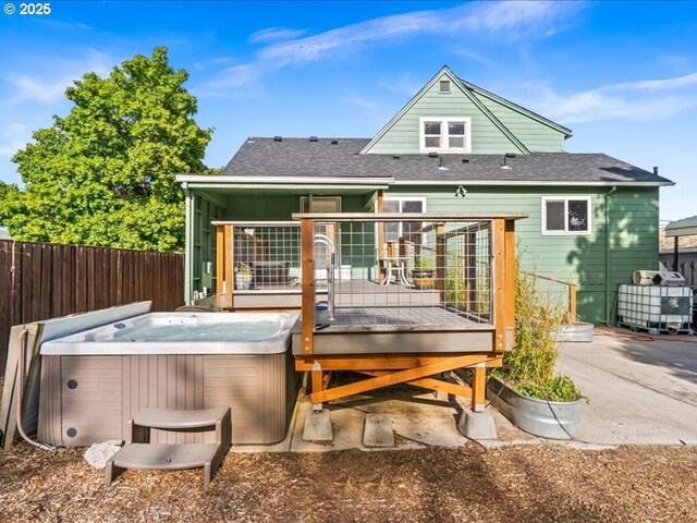 13283 NW Main St, Banks, OR 97106 - rear view of house featuring a hot tub, a deck, a shingled roof, and a patio area
