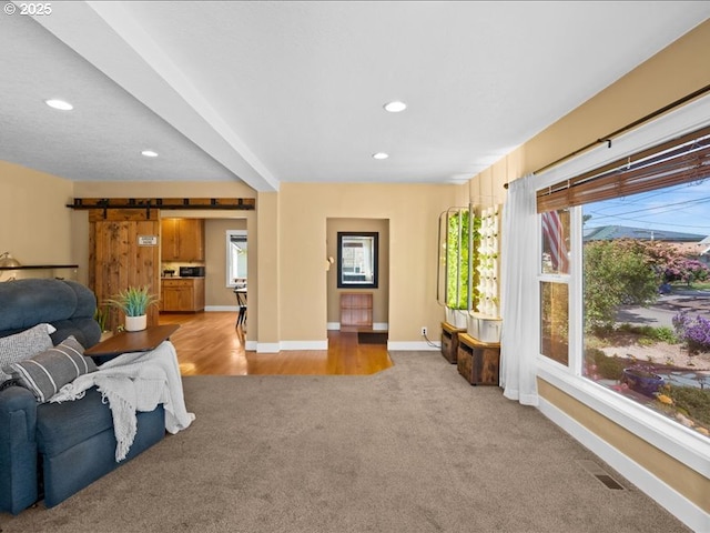 13283 NW Main St, Banks, OR 97106 - living room featuring light carpet, baseboards, and recessed lighting