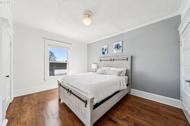 bedroom featuring dark wood-style floors, baseboards, and ornamental molding