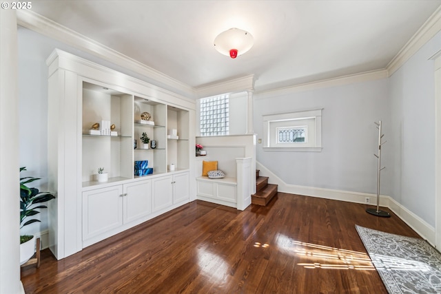 interior space featuring baseboards, dark wood finished floors, stairs, crown molding, and built in shelves