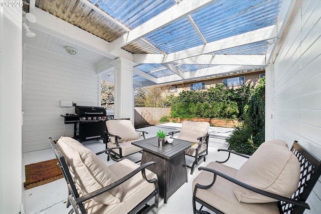 view of patio / terrace with fence, area for grilling, and an outdoor hangout area