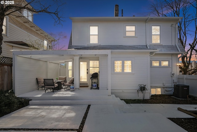 back of house with a patio area, fence, and central AC unit