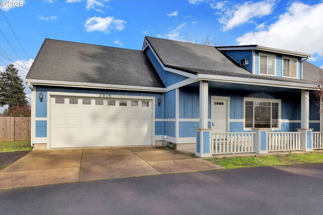 view of front of home with a garage and covered porch