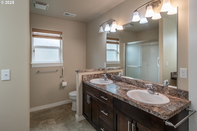 full bath with plenty of natural light, visible vents, and a sink