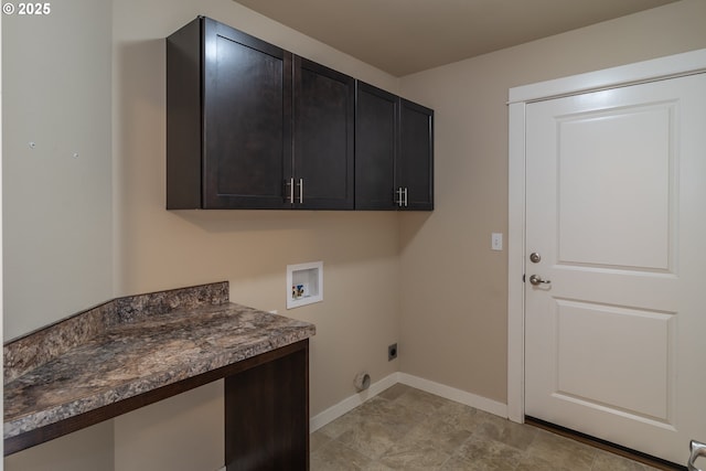 washroom with baseboards, cabinet space, hookup for an electric dryer, and washer hookup