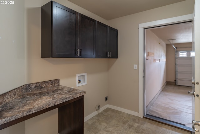 washroom with hookup for a washing machine, cabinet space, baseboards, and electric dryer hookup