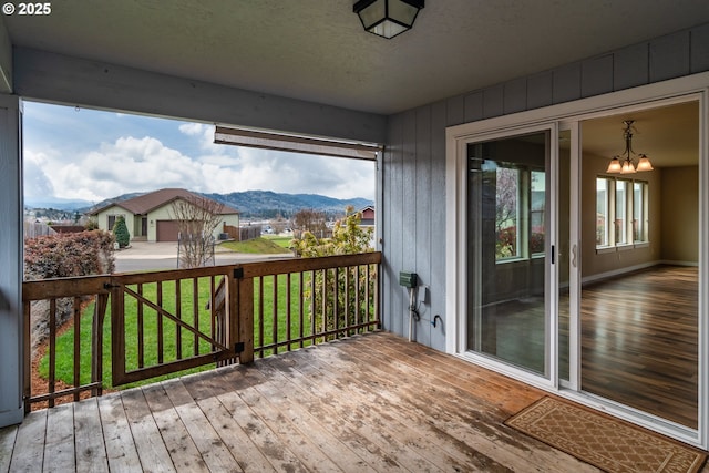 deck featuring a yard and a mountain view