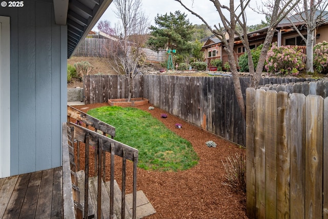 view of yard featuring a vegetable garden and fence