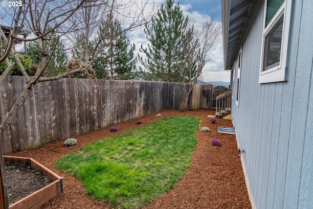 view of yard with a fenced backyard