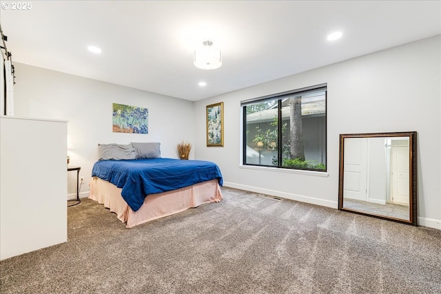 carpeted bedroom featuring recessed lighting and baseboards