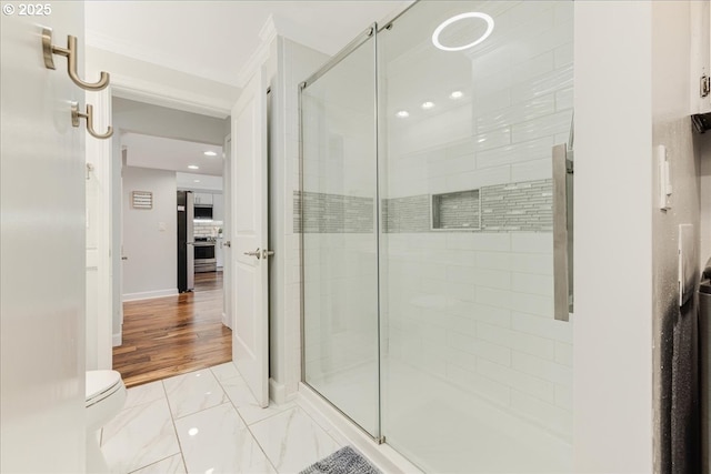 full bathroom with baseboards, toilet, marble finish floor, a shower stall, and recessed lighting