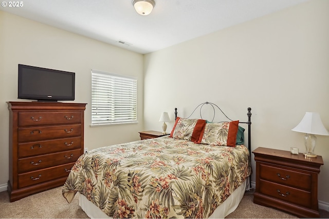 bedroom featuring carpet and visible vents