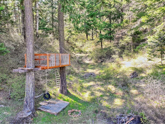 surrounding community featuring a deck