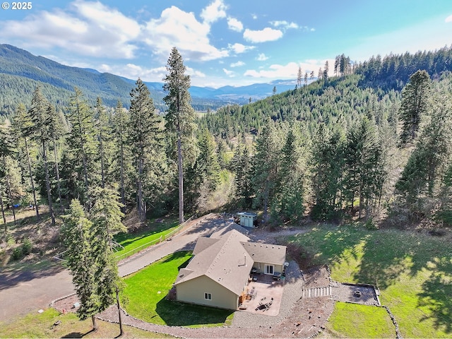 aerial view with a forest view and a mountain view