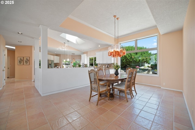 1421 SE 79th Ct, Vancouver, WA 98664 - dining area with a skylight, a chandelier, a textured ceiling, and recessed lighting