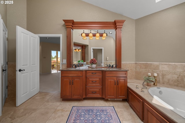 1421 SE 79th Ct, Vancouver, WA 98664 - bathroom featuring double vanity, a garden tub, lofted ceiling, and tile patterned floors